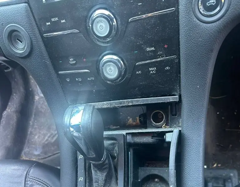 Dirty center console before detailing