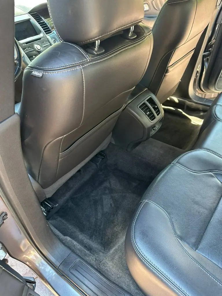 Clean rear footwell carpets after extraction